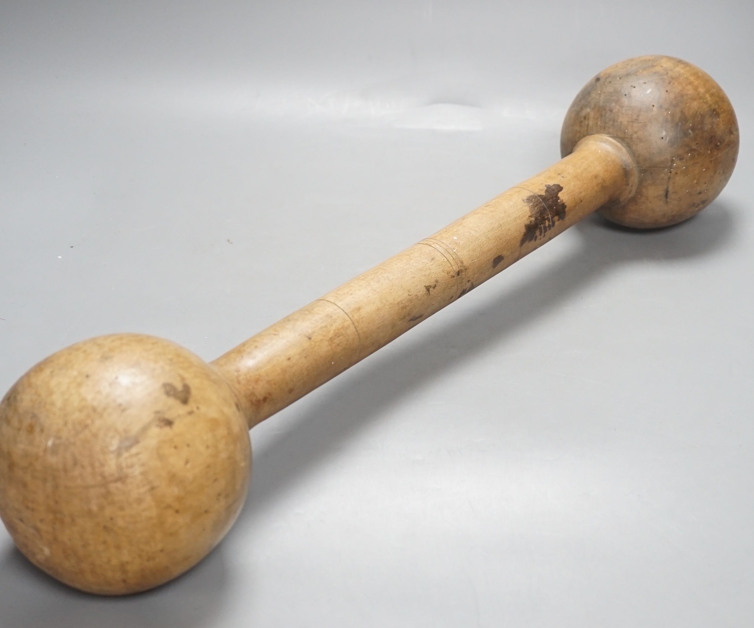 A turned beech wine grape masher - 61cm